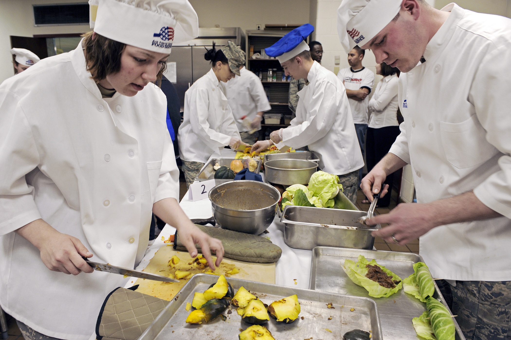 Hospitality trainer demonstrating food preparation